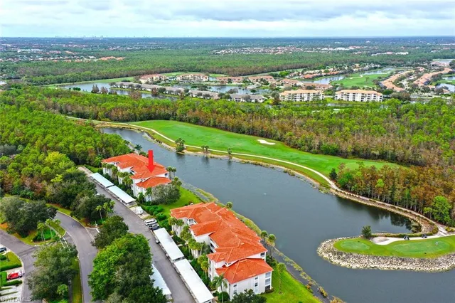 an aerial view of a house with a lake view