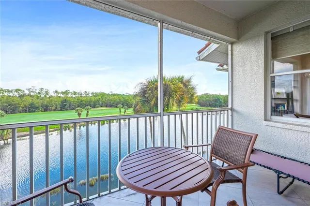 a view of a two chairs in the balcony