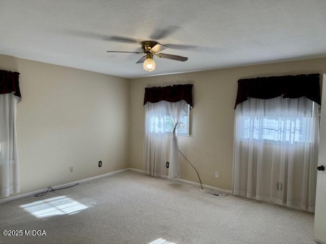 66 Quail Trail Juliette, GA 31046 - Photo 20 of 25 an empty room with chandelier fan and wooden floor