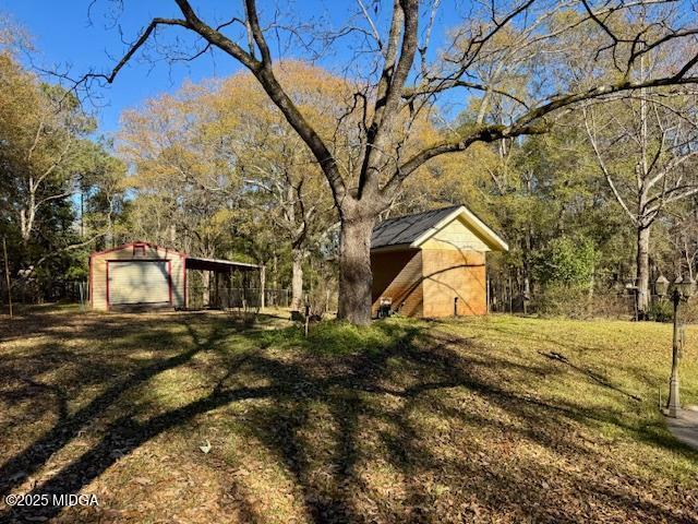 66 Quail Trail Juliette, GA 31046 - Photo 22 of 25 a view of a yard with a large tree
