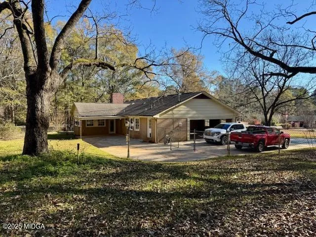 a view of road with large trees