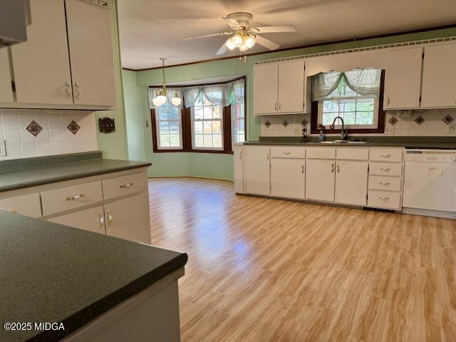 66 Quail Trail Juliette, GA 31046 - Photo 7 of 25 a kitchen with granite countertop a stove a sink and white cabinets with wooden floor