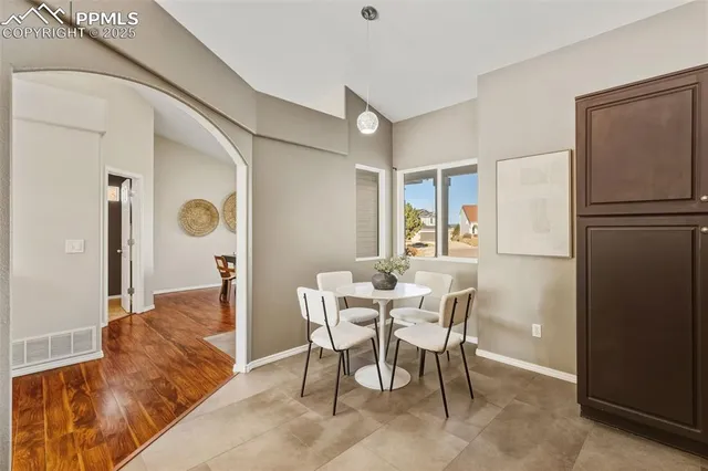 a view of a livingroom with furniture and a window
