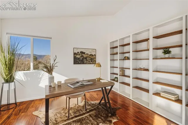a view of a livingroom with furniture and wooden floor