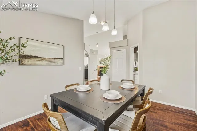 a view of a dining room with furniture and wooden floor