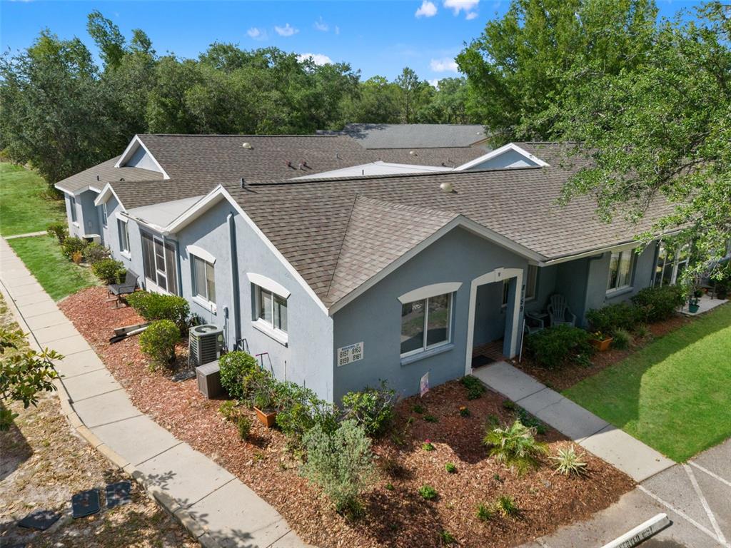 8159 Sturbridge Court, Unit 8159 Weeki Wachee, FL 34613 - Photo 1 of 27 a aerial view of a house with a yard