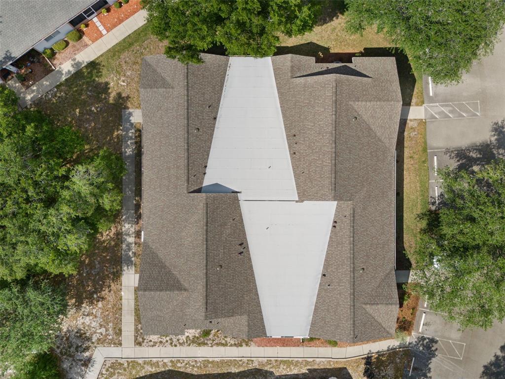 8159 Sturbridge Court, Unit 8159 Weeki Wachee, FL 34613 - Photo 21 of 27 an aerial view of a house with a yard