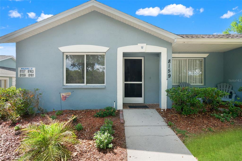 8159 Sturbridge Court, Unit 8159 Weeki Wachee, FL 34613 - Photo 27 of 27 a front view of a house with a yard