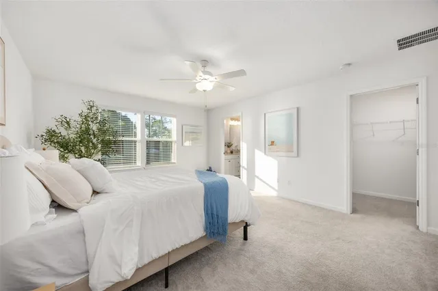 a bed room with a bed and a chandelier