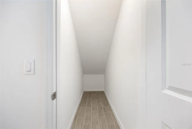 a view of a chairs and table in the balcony