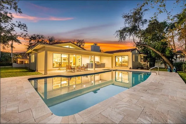 a kitchen with stainless steel appliances granite countertop a stove and a microwave