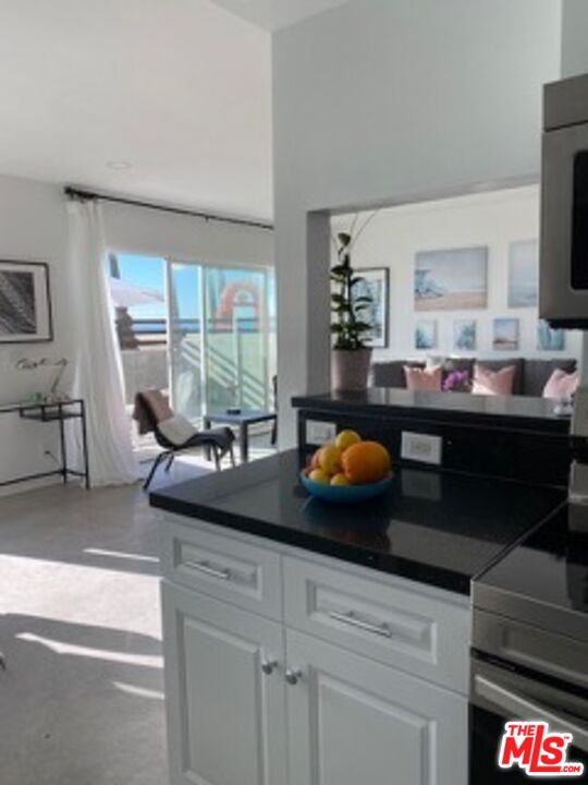 2609 Ocean Front Walk Venice, CA 90291 - Photo 13 of 17 a kitchen with a sink and large window