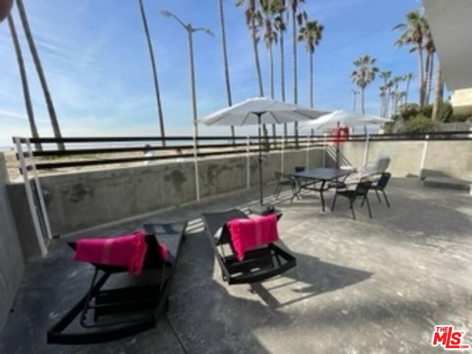 2609 Ocean Front Walk Venice, CA 90291 - Photo 17 of 17 a living room with furniture a rug and a table