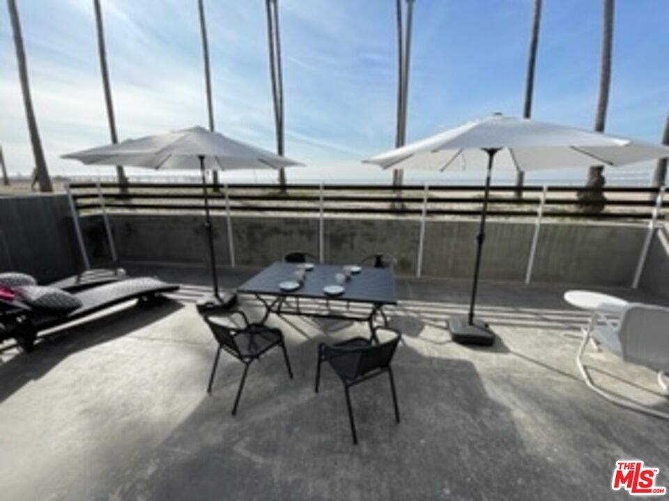 2609 Ocean Front Walk Venice, CA 90291 - Photo 2 of 17 a kitchen with a table and chairs