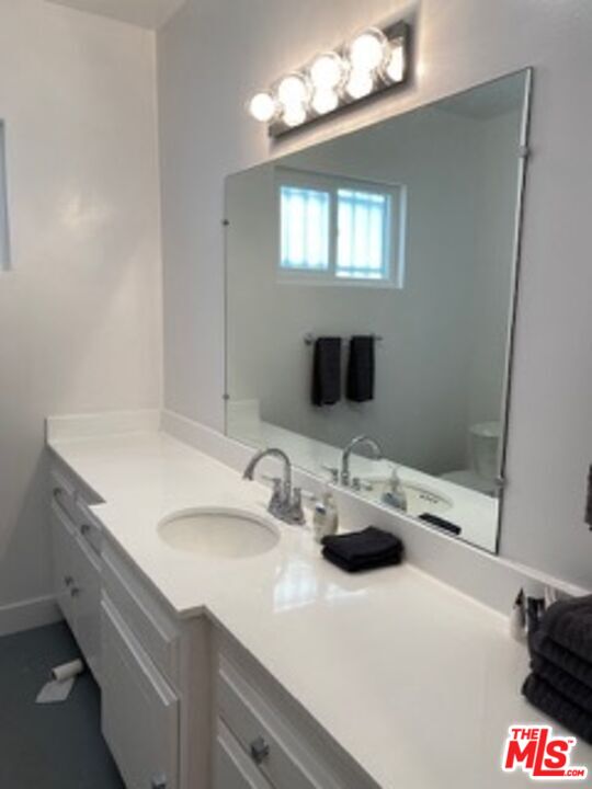 2609 Ocean Front Walk Venice, CA 90291 - Photo 4 of 17 a bathroom with a sink and a mirror