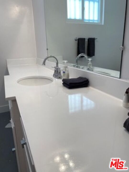 2609 Ocean Front Walk Venice, CA 90291 - Photo 5 of 17 a bathroom with a sink and a mirror