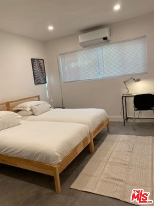 2609 Ocean Front Walk Venice, CA 90291 - Photo 6 of 17 a bedroom with a bed and a lamp