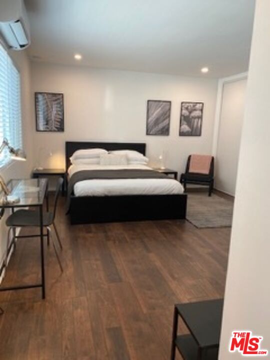 2609 Ocean Front Walk Venice, CA 90291 - Photo 10 of 17 a bedroom with a bed and a chair