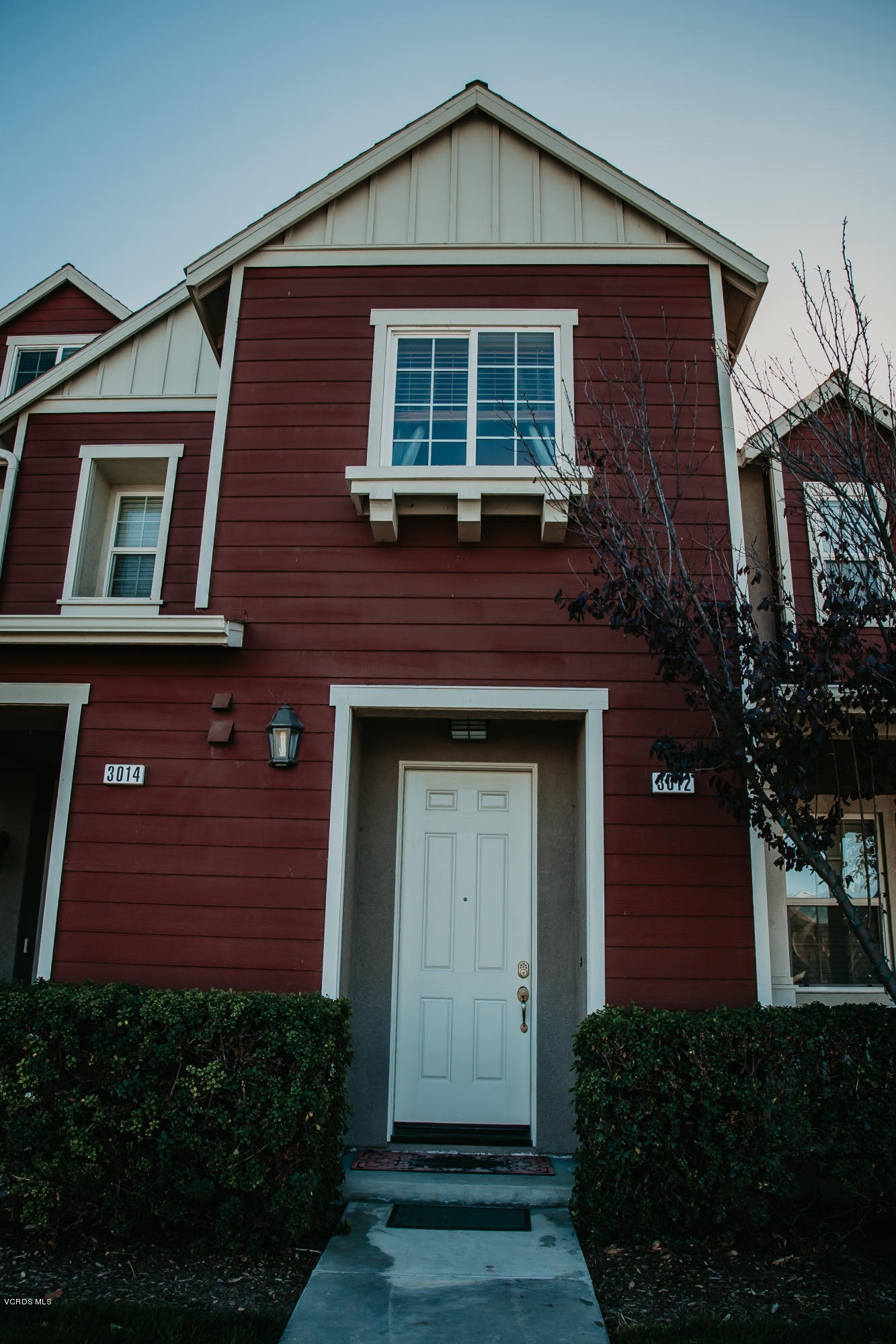 3012 Moonlight Park Avenue Oxnard, CA 93036 - Photo 1 of 59 a front view of a house with garden