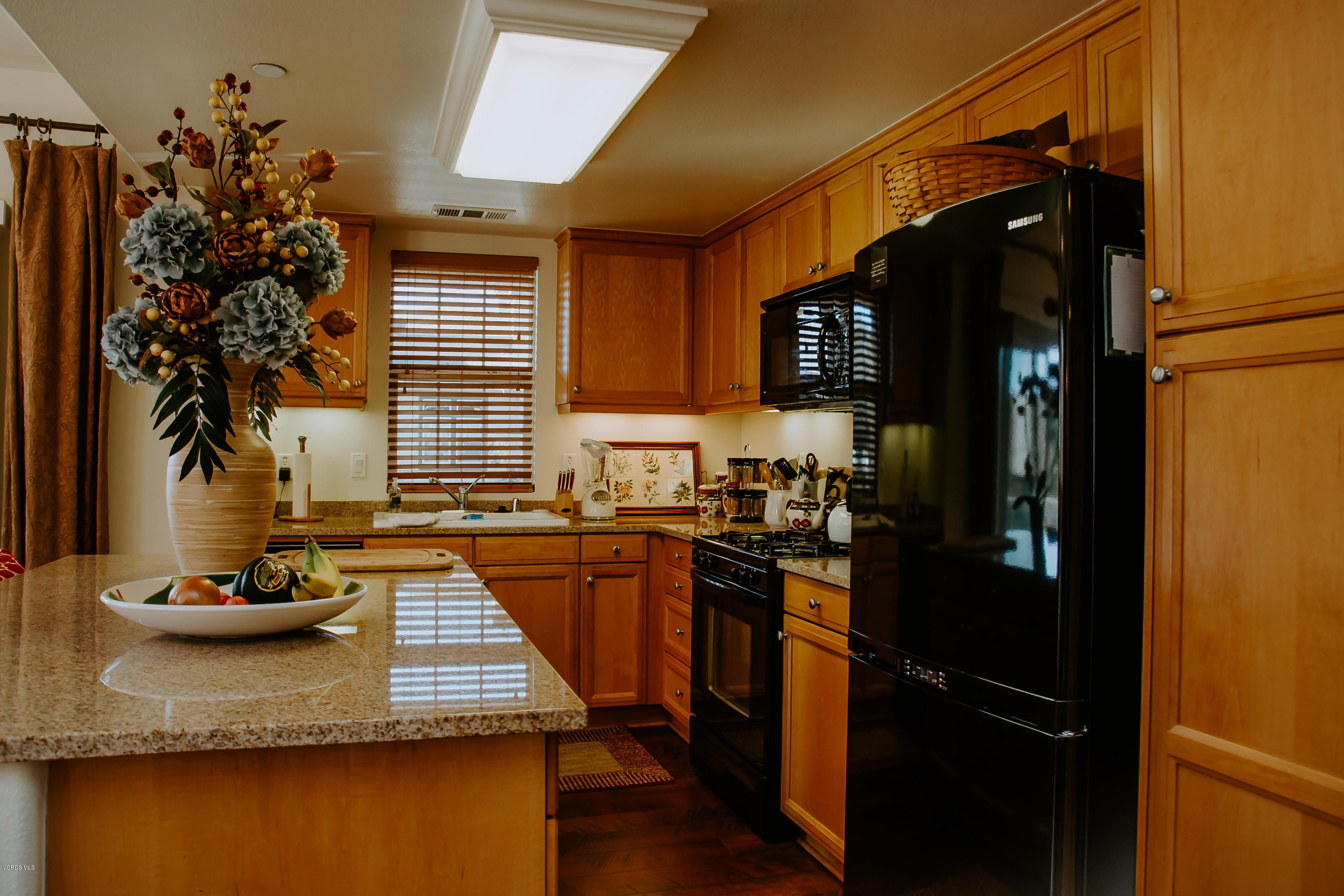 3012 Moonlight Park Avenue Oxnard, CA 93036 - Photo 19 of 59 a kitchen with sink refrigerator and stove