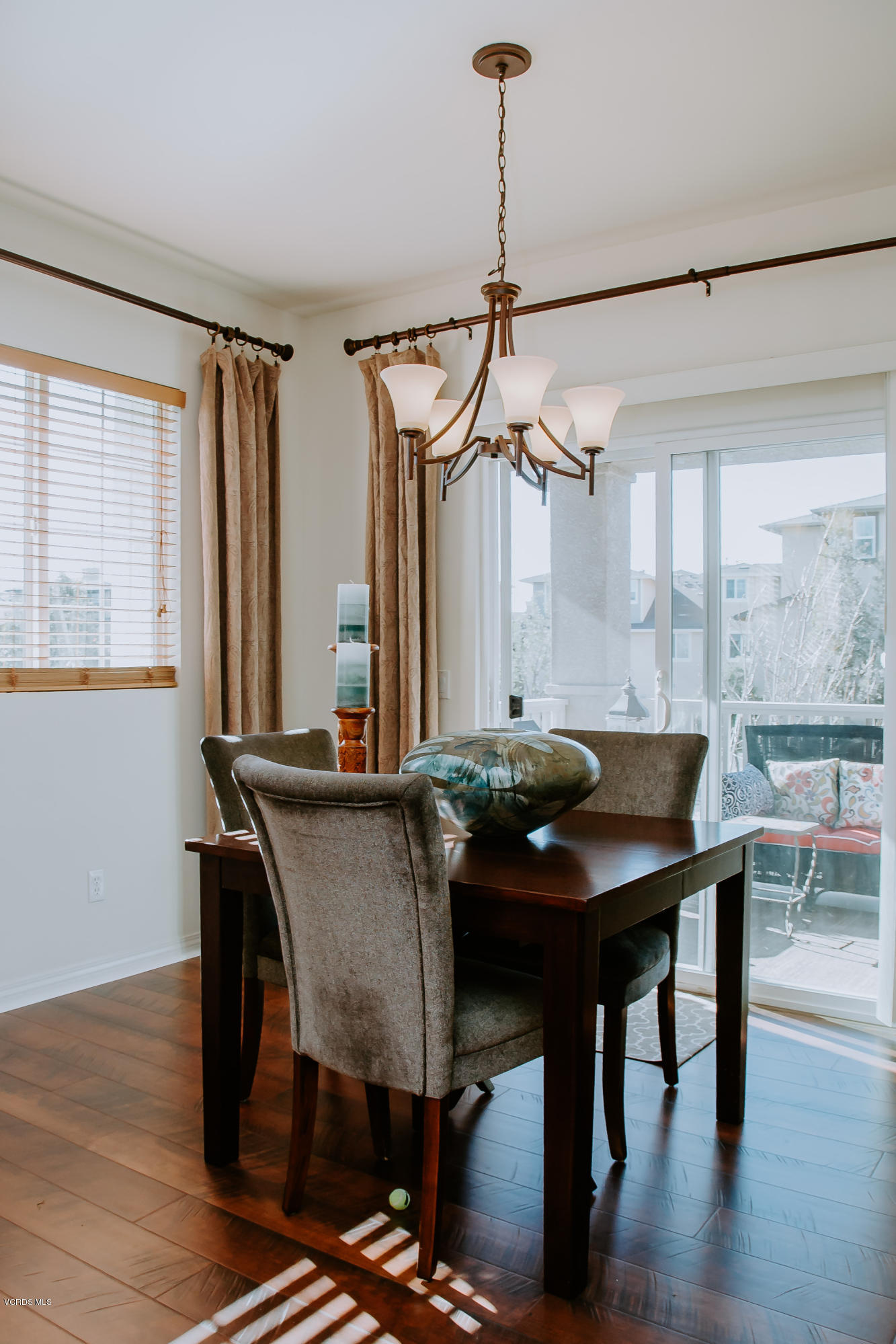 3012 Moonlight Park Avenue Oxnard, CA 93036 - Photo 23 of 59 a view of a dining table and chairs in a room