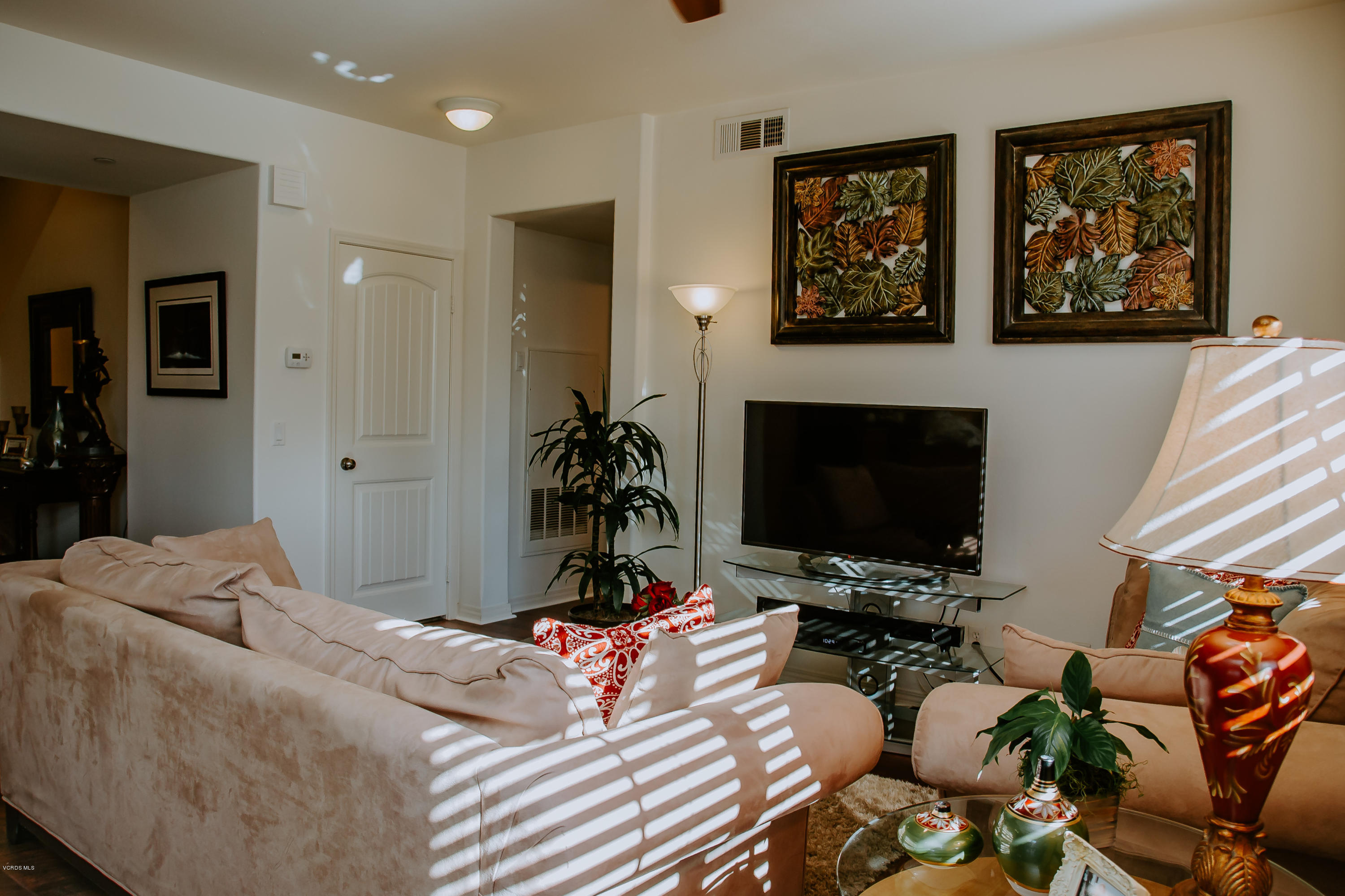 3012 Moonlight Park Avenue Oxnard, CA 93036 - Photo 26 of 59 a bedroom with furniture a flat screen tv and a fireplace