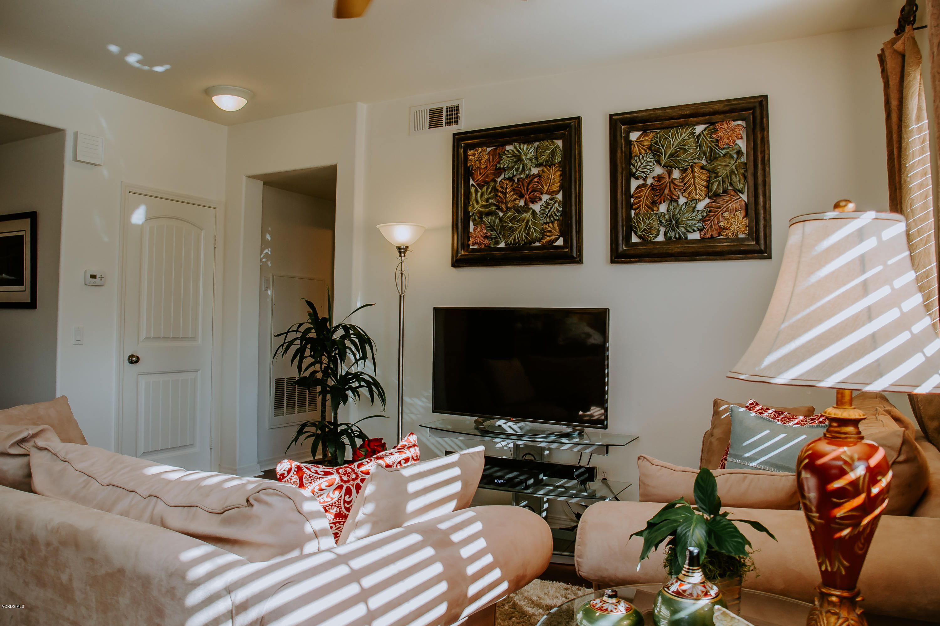 3012 Moonlight Park Avenue Oxnard, CA 93036 - Photo 27 of 59 a living room with fireplace furniture and a flat screen tv