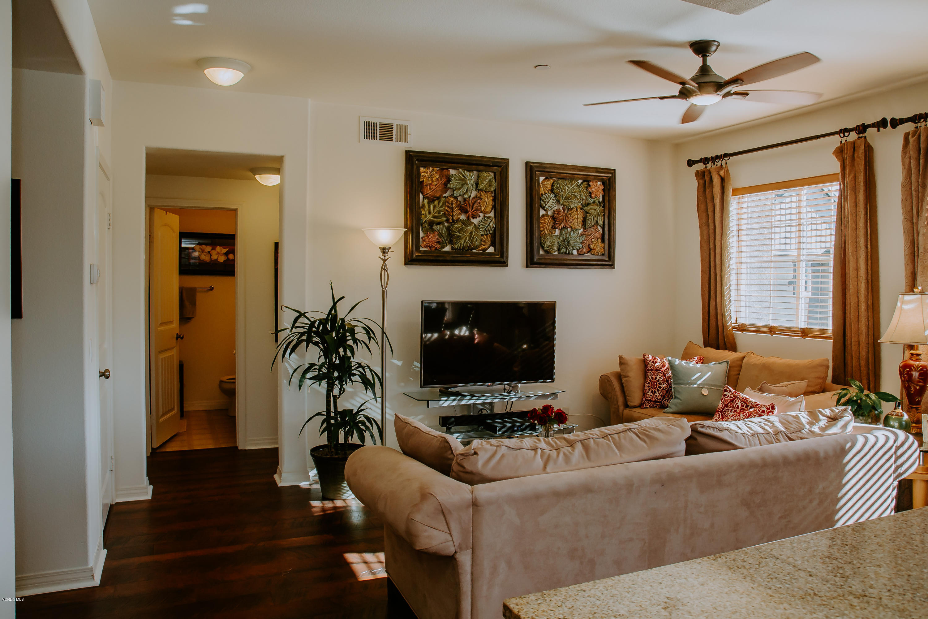 3012 Moonlight Park Avenue Oxnard, CA 93036 - Photo 28 of 59 a living room with furniture and a fireplace