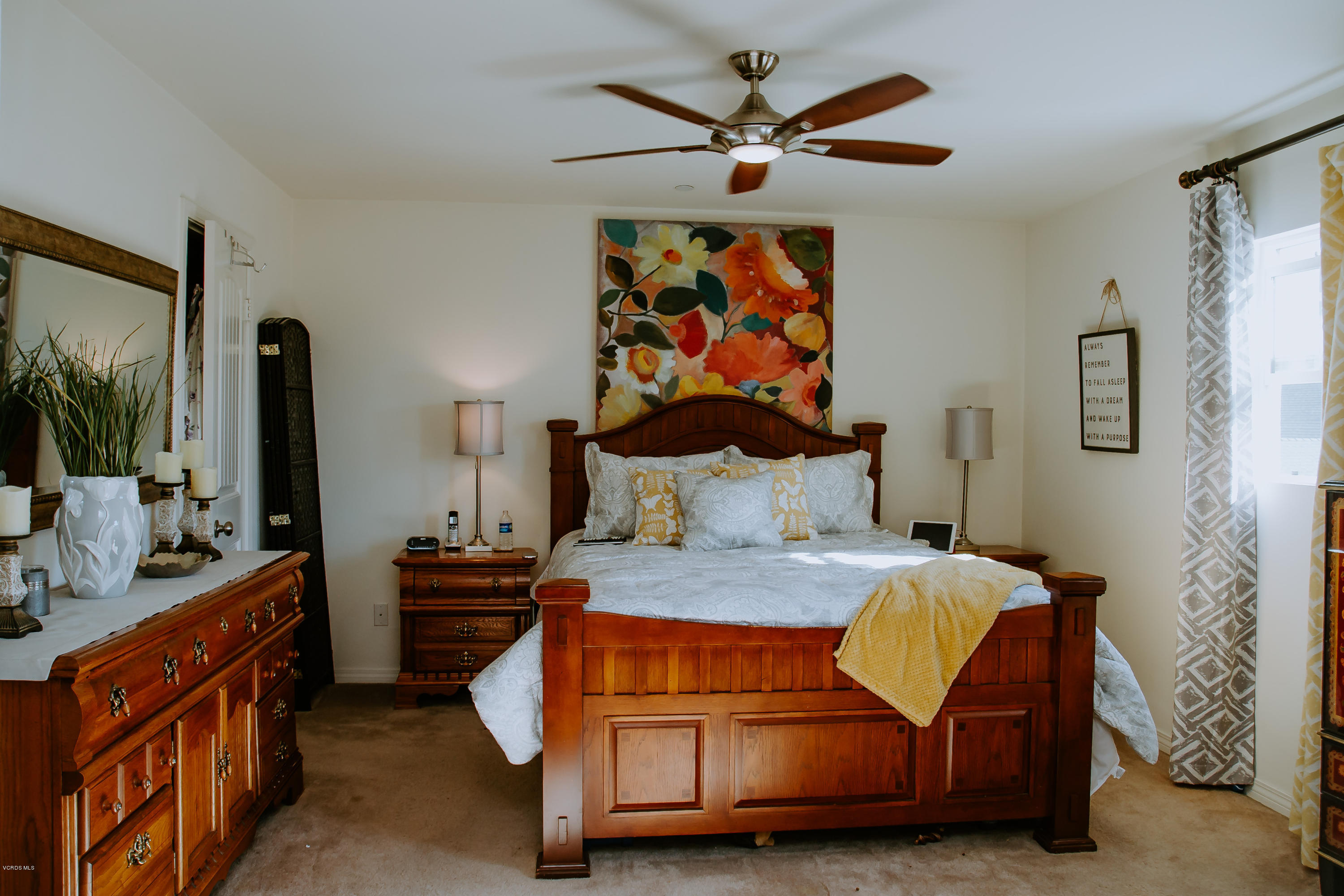 3012 Moonlight Park Avenue Oxnard, CA 93036 - Photo 34 of 59 a bedroom with a bed and a chandelier