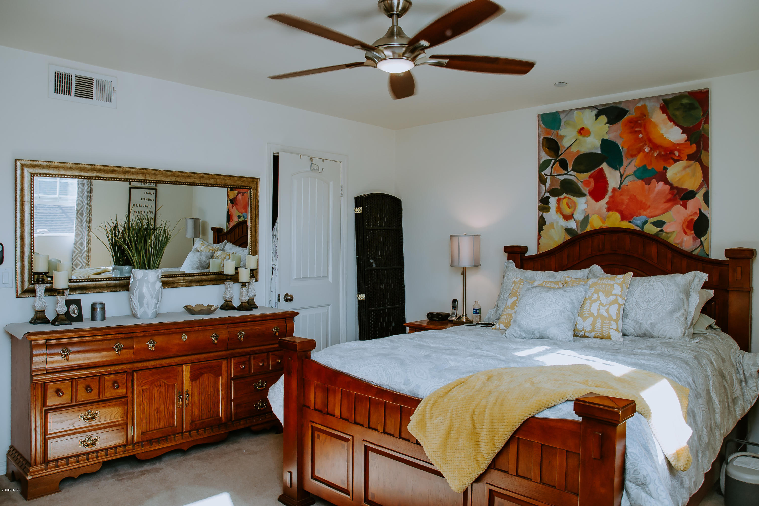 3012 Moonlight Park Avenue Oxnard, CA 93036 - Photo 35 of 59 a bedroom with a bed and a chandelier