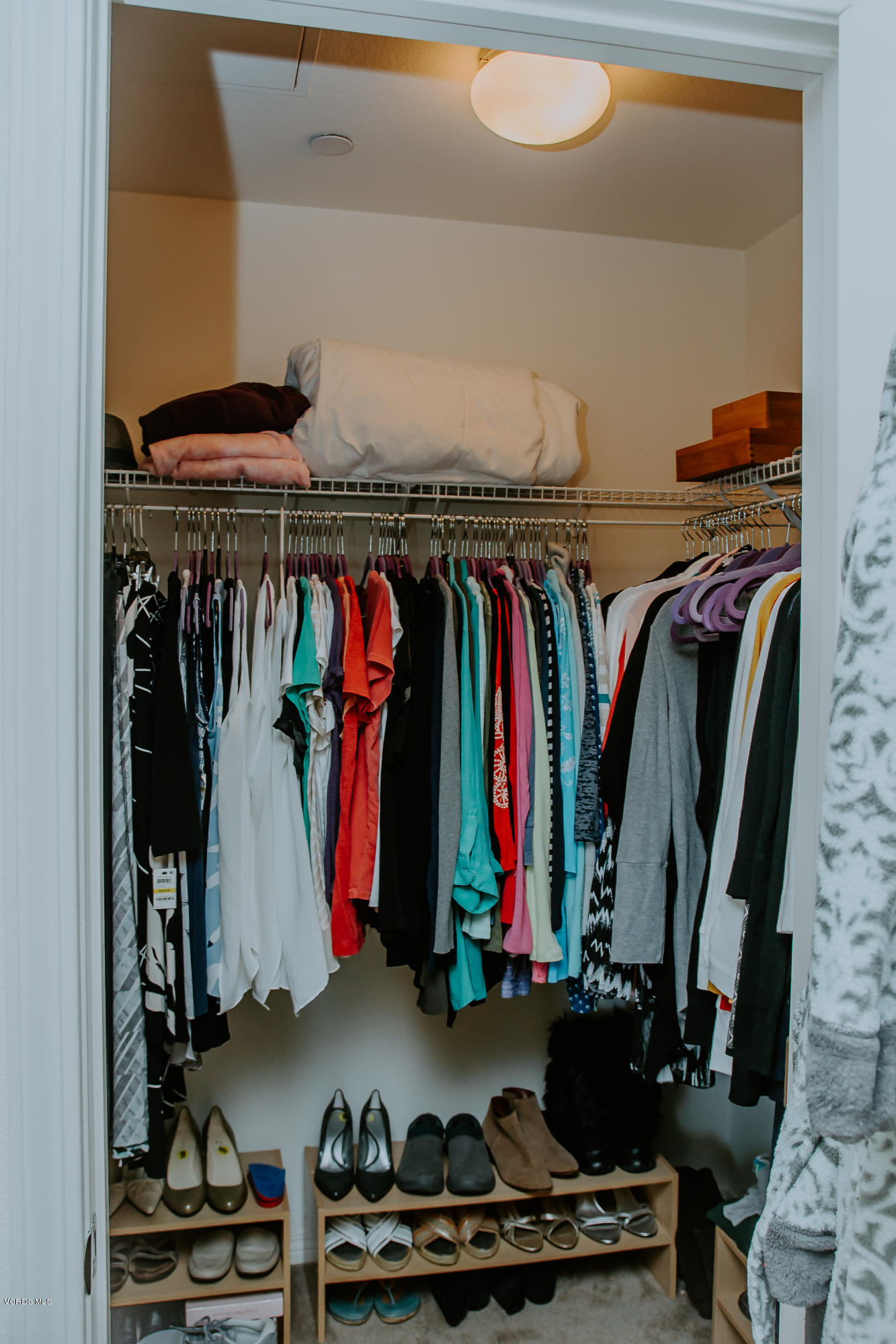 3012 Moonlight Park Avenue Oxnard, CA 93036 - Photo 37 of 59 a view of walk in closet with clothes and shoes