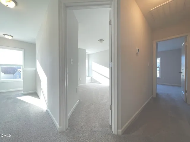 a view of a bathroom from a hallway