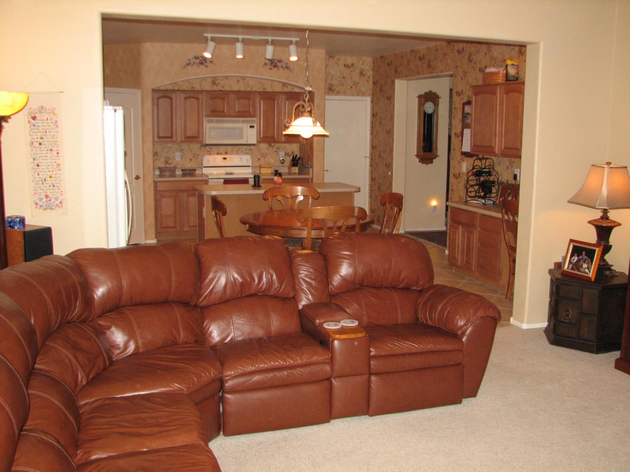 42516 Venture Road Maricopa, AZ 85138 - Photo 5 of 8 a living room with furniture and a chandelier
