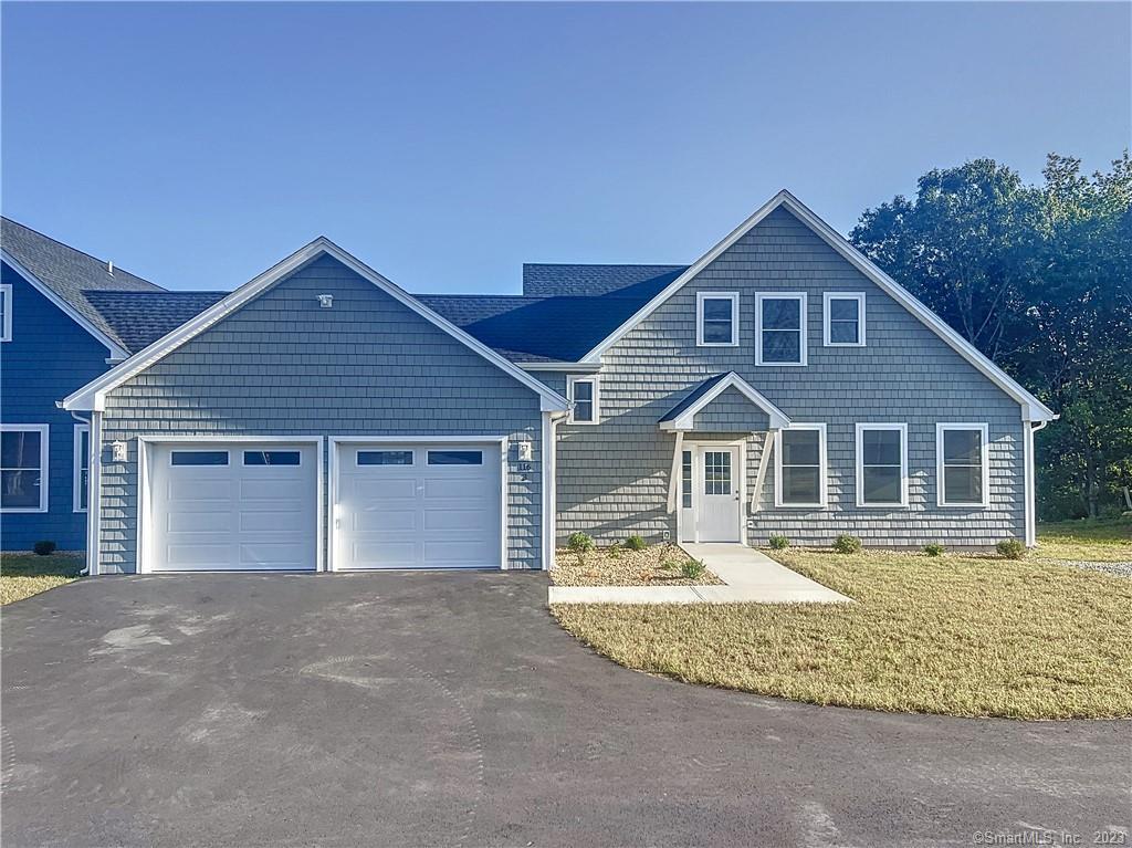116 Old Colchester Road, Unit 3 Salem, CT 06420 - Photo 1 of 1 a front view of a house with a yard
