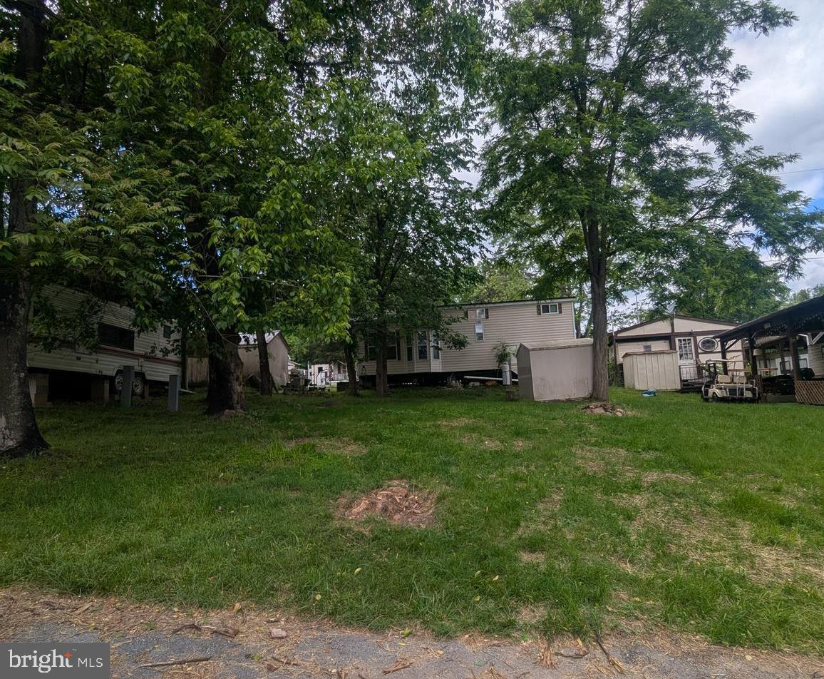 10 Block Deadwood Drive Falling Waters, WV 25419 - Photo 3 of 6 a front view of a house with a garden