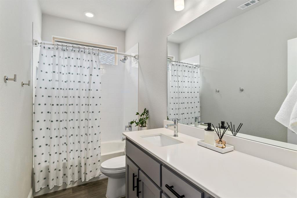 1125 Knightsbridge Road Argyle, TX 76226 - Photo 14 of 27 a bathroom with a sink toilet and shower