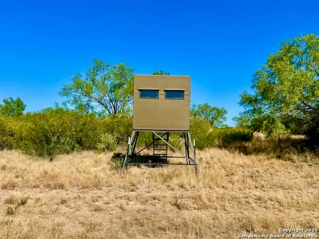 a wooden bench sitting in front of a house