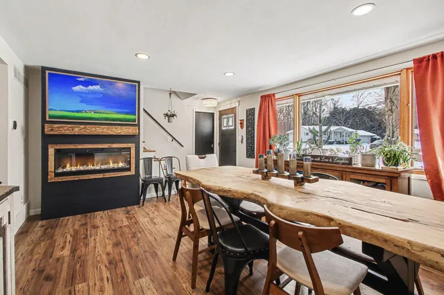 a view of a dining room with furniture window and outside view