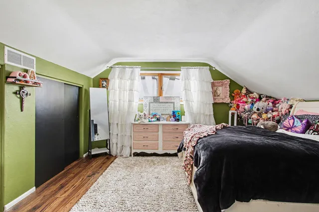 a bed room with a bed and a window