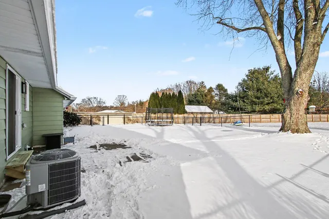 a view of a backyard of the house