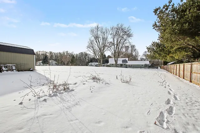 a view of snow on the side of the road