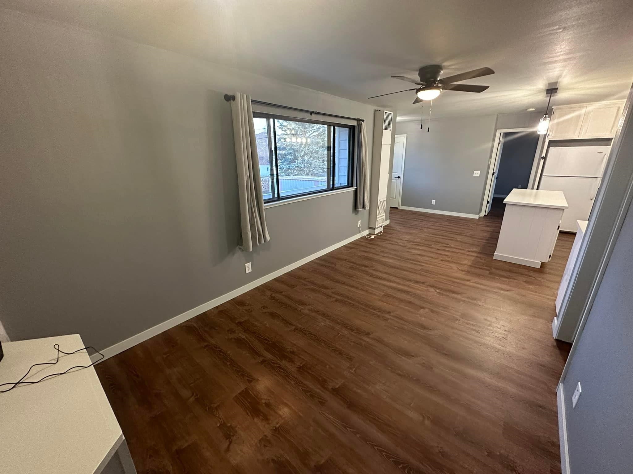 323 Main Street Bridgeport, CA 93517 - Photo 21 of 38 a view of a room with wooden floor and windows