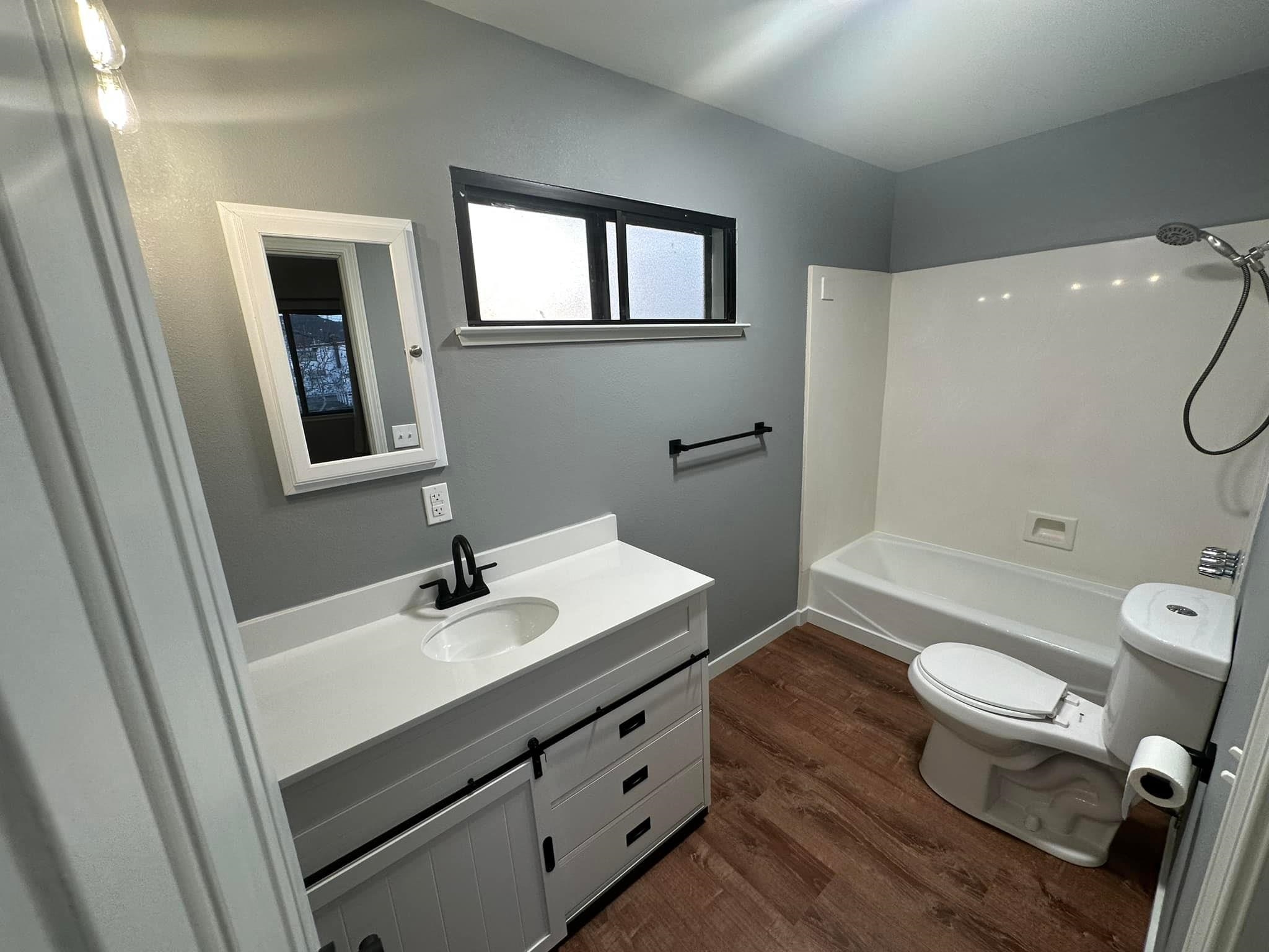 323 Main Street Bridgeport, CA 93517 - Photo 28 of 38 a bathroom with a sink a toilet and shower