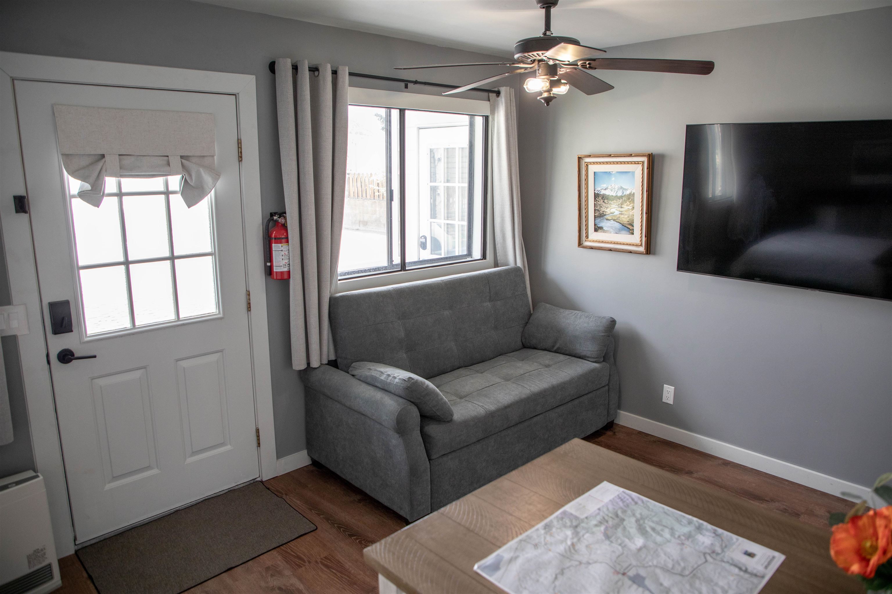 323 Main Street Bridgeport, CA 93517 - Photo 30 of 38 a living room with furniture and a flat screen tv