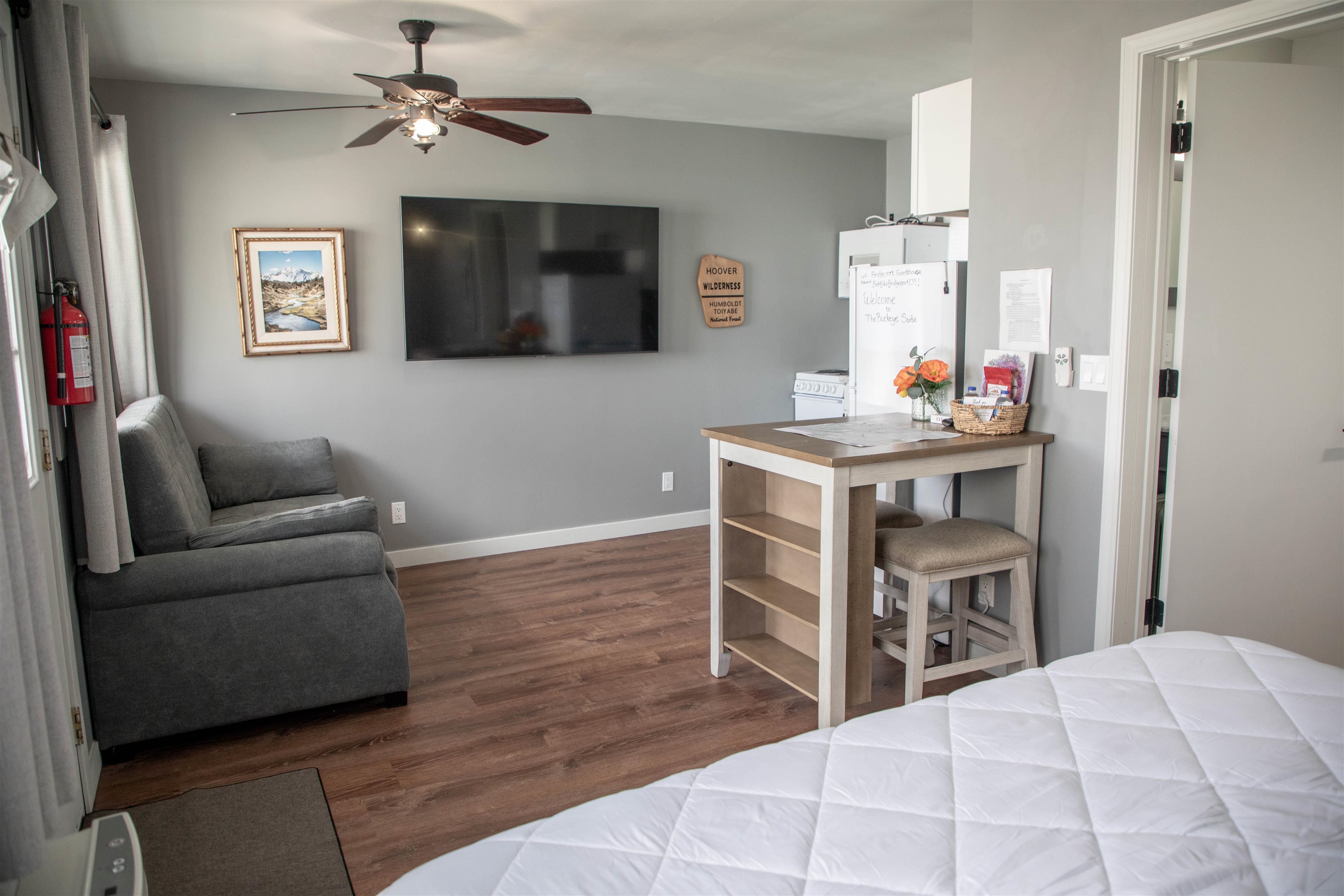 323 Main Street Bridgeport, CA 93517 - Photo 31 of 38 a bedroom with furniture and a flat screen tv