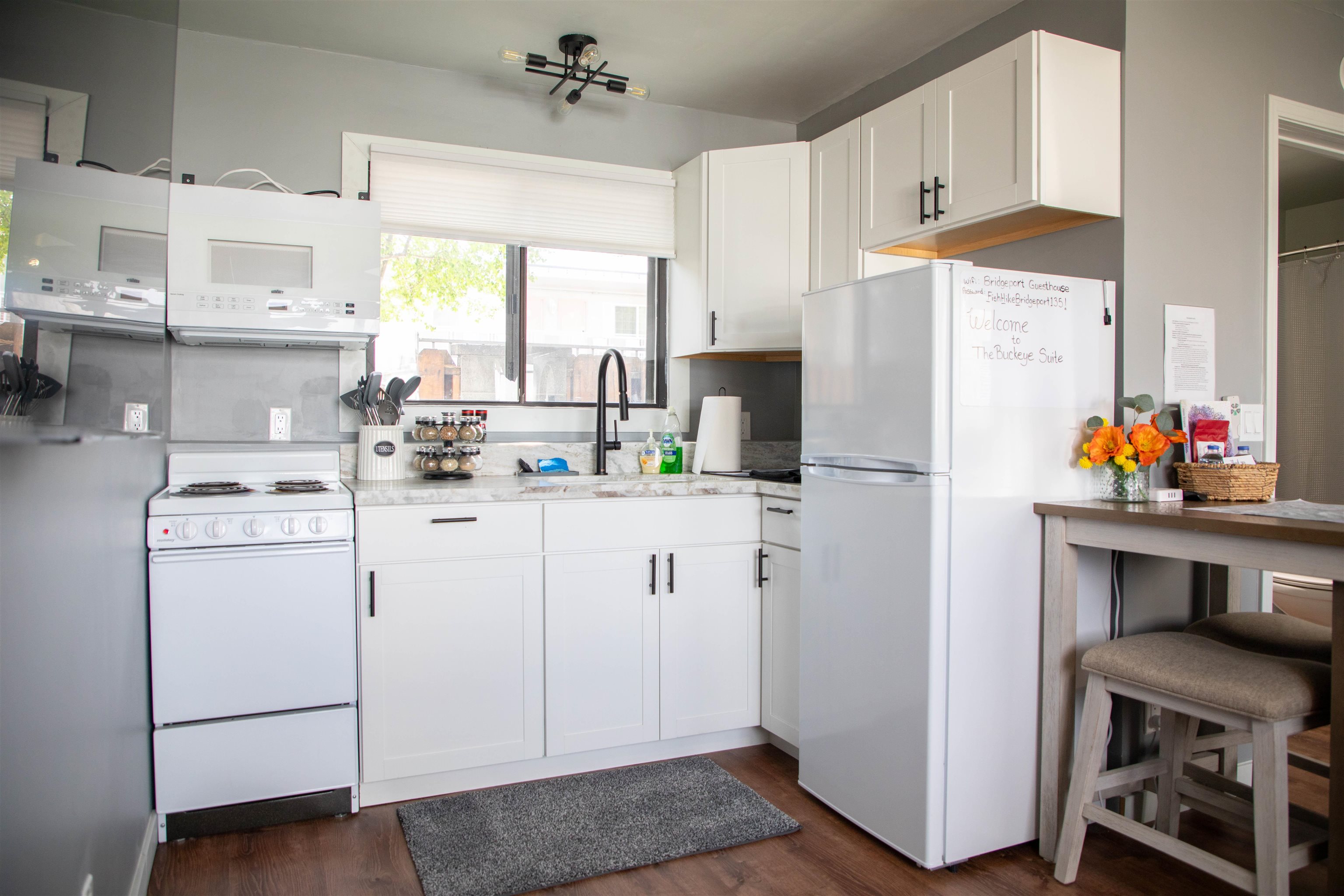 323 Main Street Bridgeport, CA 93517 - Photo 32 of 38 a kitchen with refrigerator a stove a sink and a cabinets