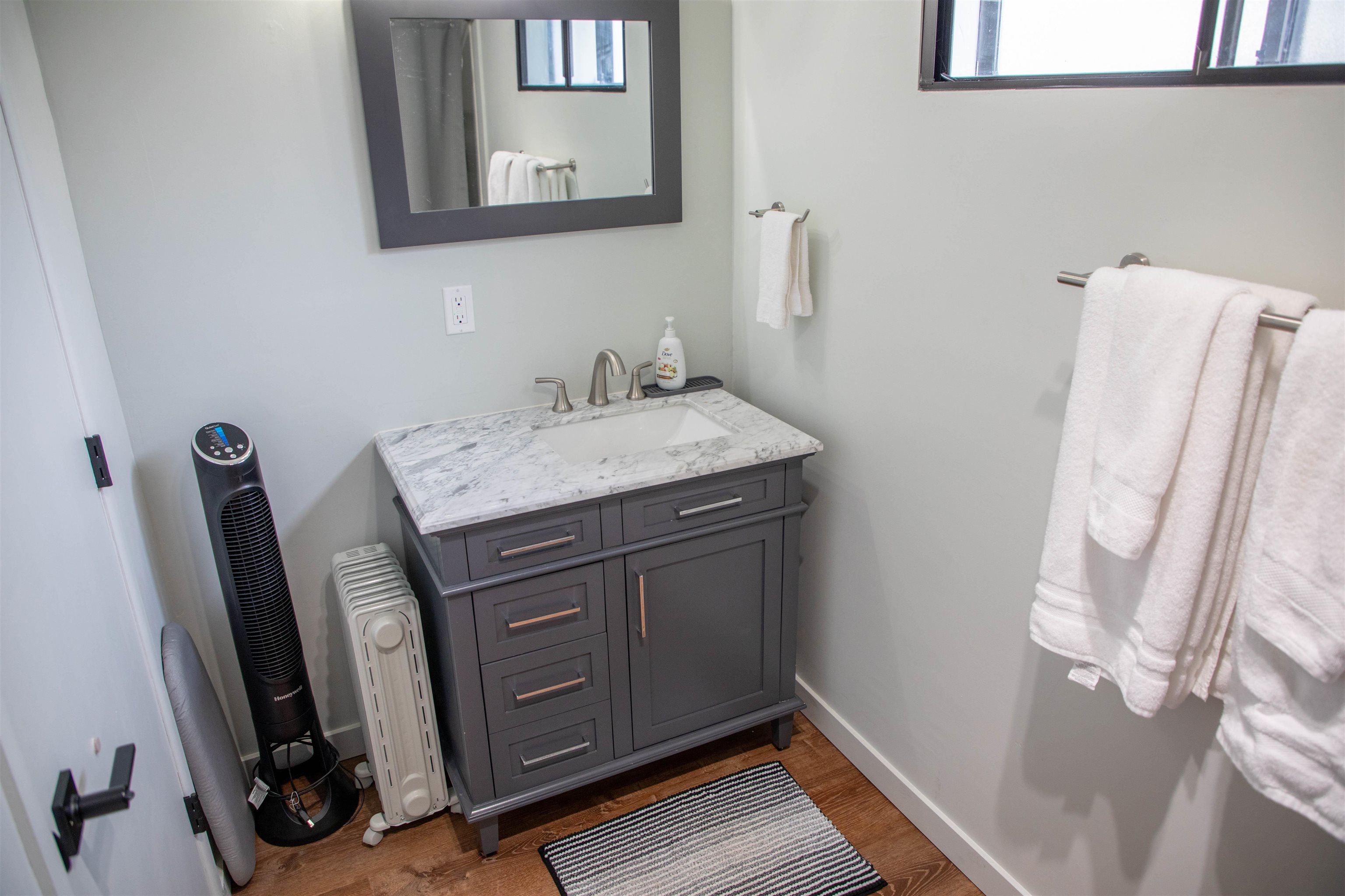 323 Main Street Bridgeport, CA 93517 - Photo 35 of 38 a view of a bathroom with a sink and a mirror