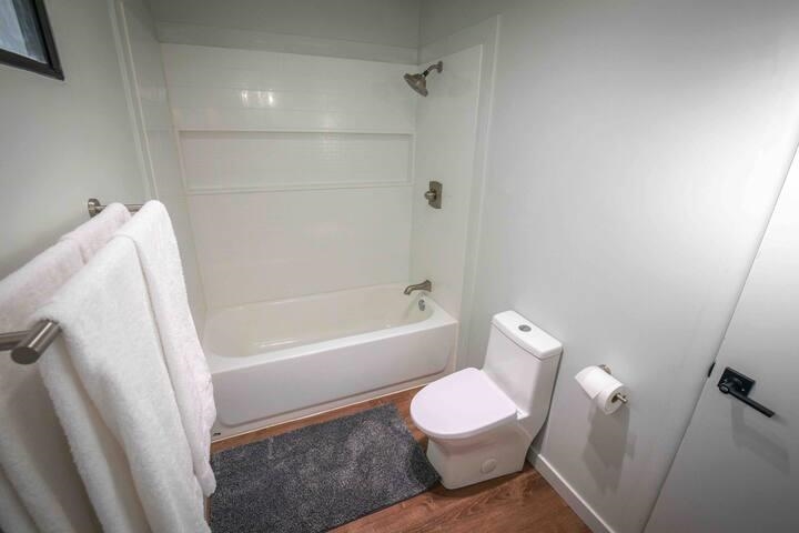 323 Main Street Bridgeport, CA 93517 - Photo 36 of 38 a bathroom with a toilet and a bathtub