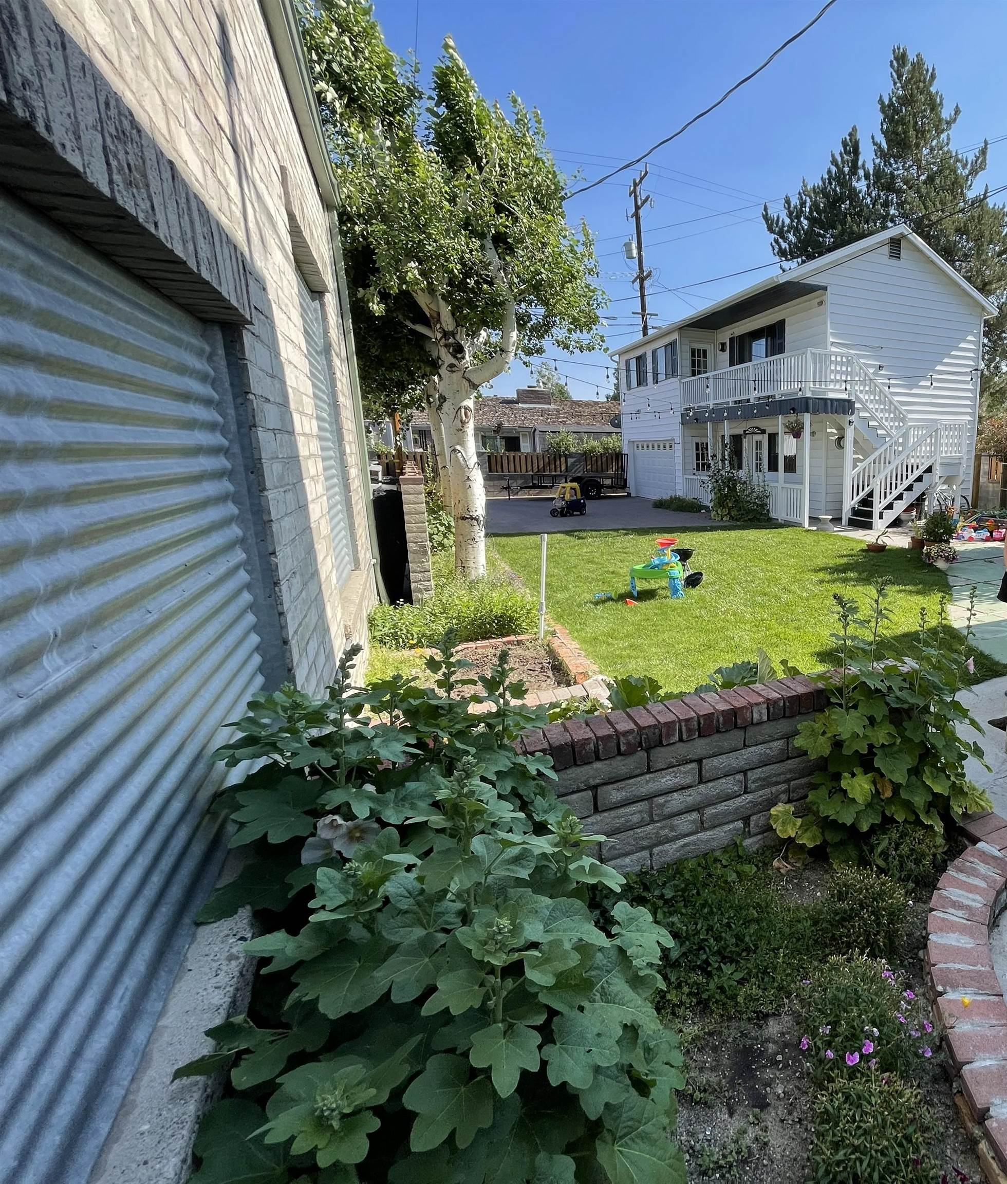 323 Main Street Bridgeport, CA 93517 - Photo 7 of 38 a view of a house with a backyard and a garden
