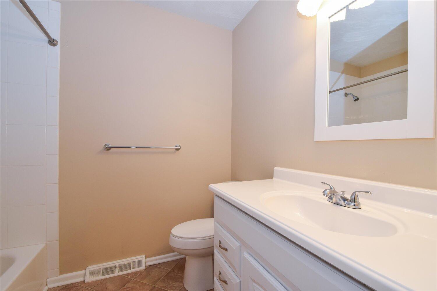 2947 Purple Finch Road Roanoke, VA 24018 - Photo 14 of 31 a bathroom with a sink toilet and vanity